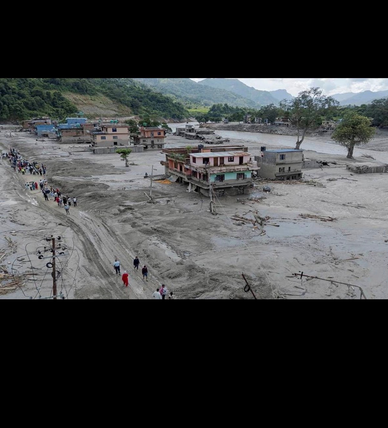 An aerial view shows the scale of destruction left by the flood surge across affected communities. (File photo)