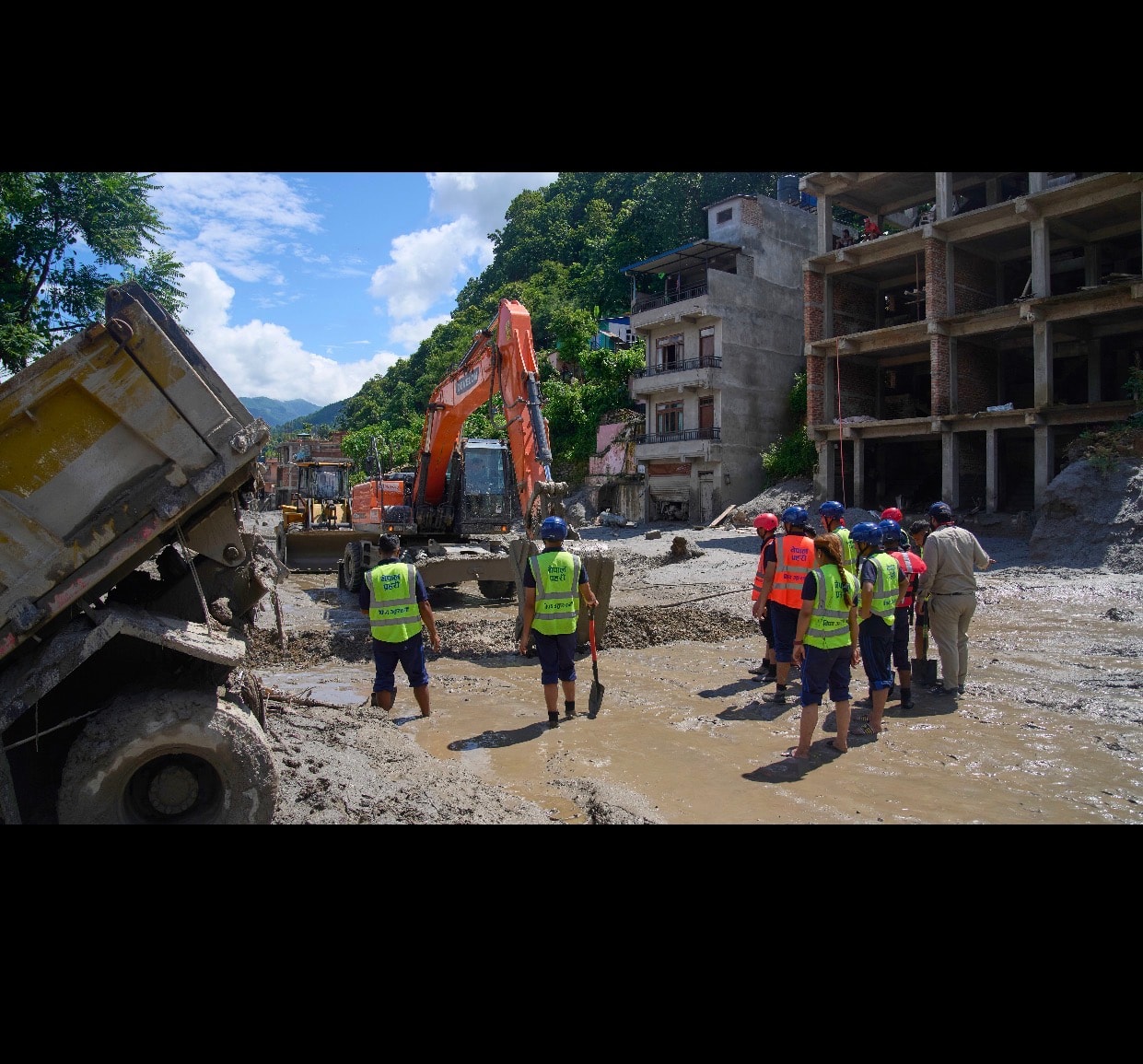 Rescue and recovery crews work to clear debris at one of the affected sites. (File photo)